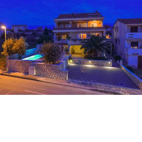 Apartments and rooms with a swimming pool Novalja, Pag - 9334