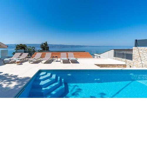New! Villa Atopos with heated private pool, 5 bedrooms, Cinema room, panoramic sea views