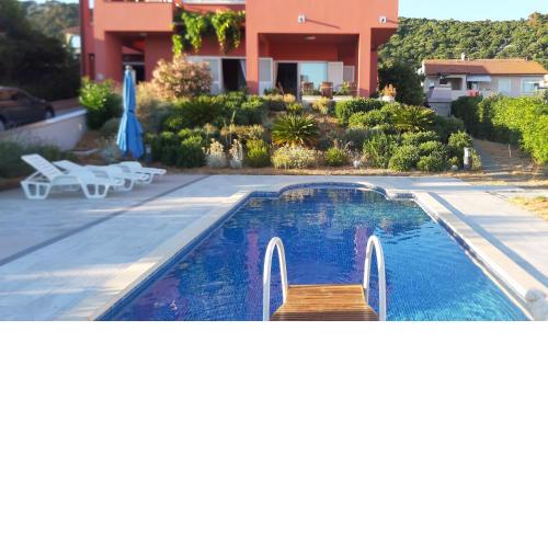 Seaside apartments with a swimming pool Barbat, Rab - 4980
